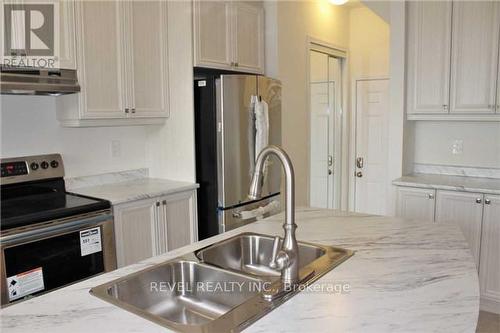 1406 Whitney Terrace, Milton, ON - Indoor Photo Showing Kitchen With Double Sink