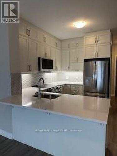 313 - 3265 Carding Mill Trail, Oakville, ON - Indoor Photo Showing Kitchen