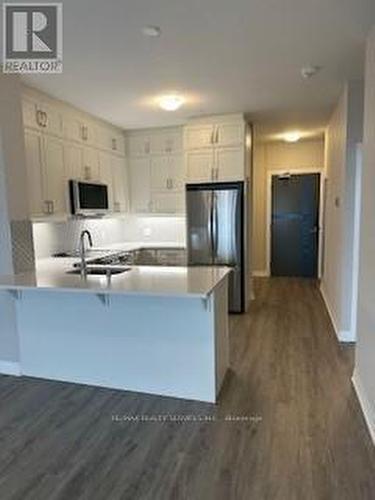 313 - 3265 Carding Mill Trail, Oakville, ON - Indoor Photo Showing Kitchen With Stainless Steel Kitchen With Double Sink