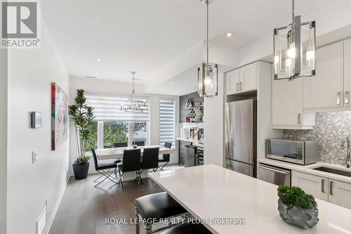 8 - 70 Thomas Mulholland Drive, Toronto, ON - Indoor Photo Showing Kitchen With Stainless Steel Kitchen With Upgraded Kitchen