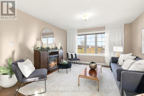 82 Dorchester Drive, Prince Edward County (Wellington), ON - Indoor Photo Showing Living Room With Fireplace