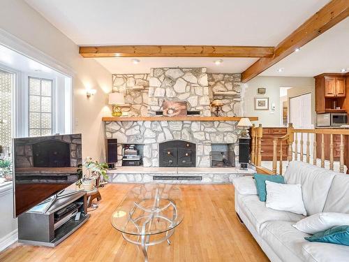 Family room - 1671 Mtée Monette, Laval (Vimont), QC - Indoor Photo Showing Living Room With Fireplace