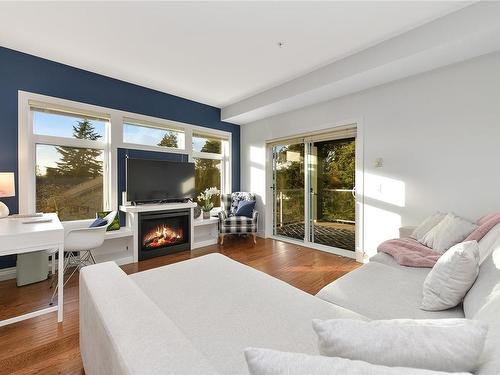 201-2415 Amherst Ave, Sidney, BC - Indoor Photo Showing Living Room With Fireplace