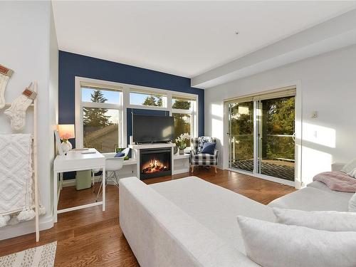 201-2415 Amherst Ave, Sidney, BC - Indoor Photo Showing Living Room With Fireplace