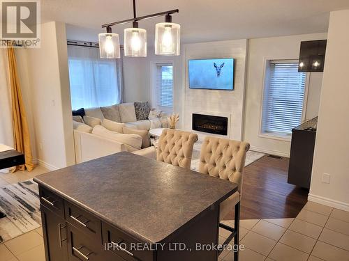 153 Winders Trail, Ingersoll, ON - Indoor Photo Showing Dining Room With Fireplace