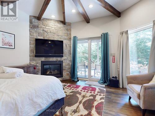 106 Plater Street, Blue Mountains, ON - Indoor Photo Showing Bedroom With Fireplace