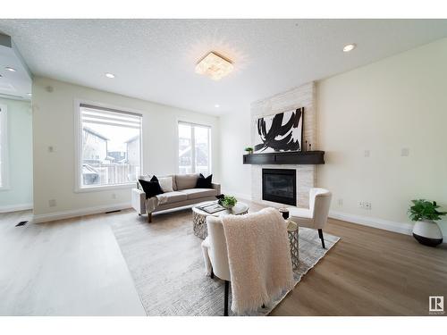 2615 Blue Jay Cl Nw, Edmonton, AB - Indoor Photo Showing Living Room With Fireplace