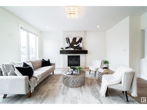 2615 Blue Jay Cl Nw, Edmonton, AB - Indoor Photo Showing Living Room With Fireplace