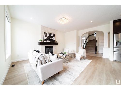 2615 Blue Jay Cl Nw, Edmonton, AB - Indoor Photo Showing Living Room With Fireplace