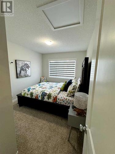 20 Cranbrook Green Se, Calgary, AB - Indoor Photo Showing Bedroom