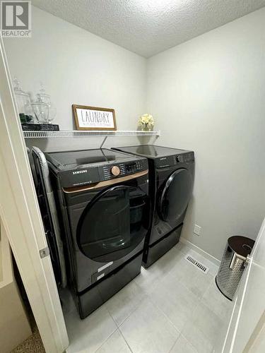 20 Cranbrook Green Se, Calgary, AB - Indoor Photo Showing Laundry Room