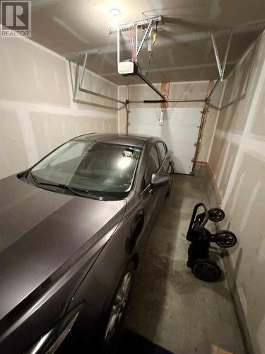 20 Cranbrook Green Se, Calgary, AB - Indoor Photo Showing Garage