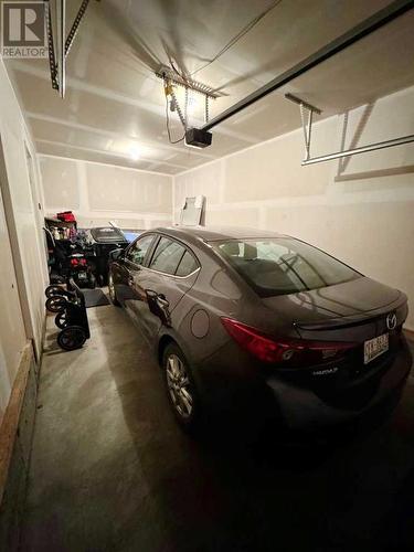 20 Cranbrook Green Se, Calgary, AB - Indoor Photo Showing Garage