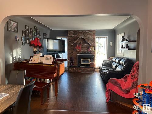 9624 75A St Nw, Edmonton, AB - Indoor Photo Showing Living Room With Fireplace