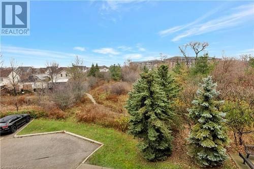 View of green belt - 41 Goodwin Drive Unit# 306, Guelph, ON - Outdoor With View