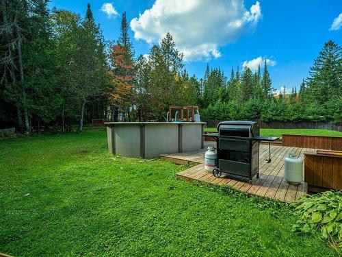 Pool - 109 Rue Du Sommet-Vert, Sainte-Marguerite-Du-Lac-Masson, QC - Outdoor With Above Ground Pool With Backyard