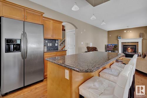 3017 Macneil Wy Nw, Edmonton, AB - Indoor Photo Showing Kitchen With Fireplace