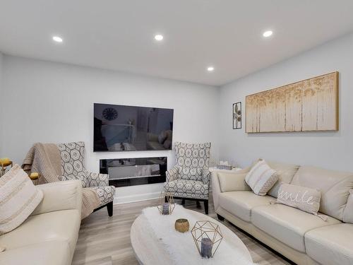 Living room - 740 Rue Luc, Laval (Sainte-Dorothée), QC - Indoor Photo Showing Living Room With Fireplace