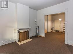 Unit 56 Unfurnished living room with dark carpet - 