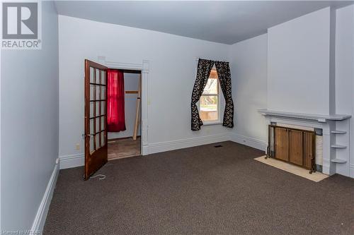 Unit 56 Unfurnished living room with carpet floors - 60 Wellington St N/S Street N, Woodstock, ON - Indoor Photo Showing Other Room