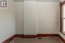 Unit 56 bedroom 1 featuring carpet flooring - 