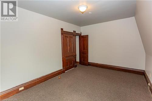 View of carpeted primary bedroom - 60 Wellington St N/S Street N, Woodstock, ON - Indoor Photo Showing Other Room