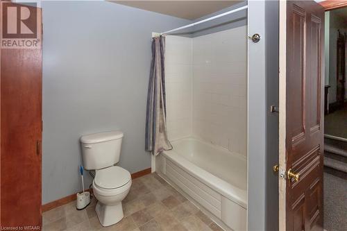 Bathroom featuring shower / tub combo and toilet - 60 Wellington St N/S Street N, Woodstock, ON - Indoor Photo Showing Bathroom