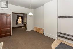 Unit 56 Unfurnished dining area with dark carpet - 