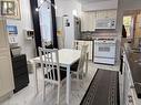 Kitchen featuring decorative backsplash, sink, and white appliances - 1087 7Th Avenue W, Owen Sound, ON  - Indoor Photo Showing Kitchen 