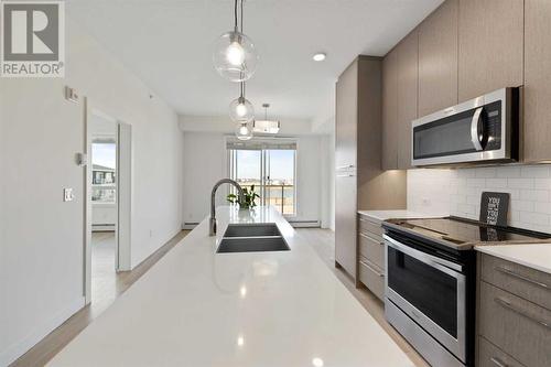 1404, 76 Cornerstone Passage Ne, Calgary, AB - Indoor Photo Showing Kitchen With Double Sink With Upgraded Kitchen