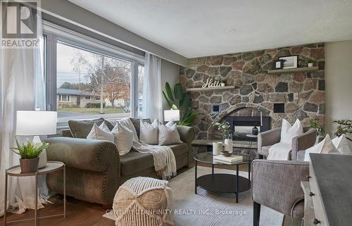 667 Sunset Boulevard, Clarington (Newcastle), ON - Indoor Photo Showing Living Room With Fireplace