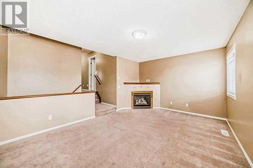 69 Saddlehorn Crescent Ne, Calgary, AB - Indoor Photo Showing Other Room With Fireplace