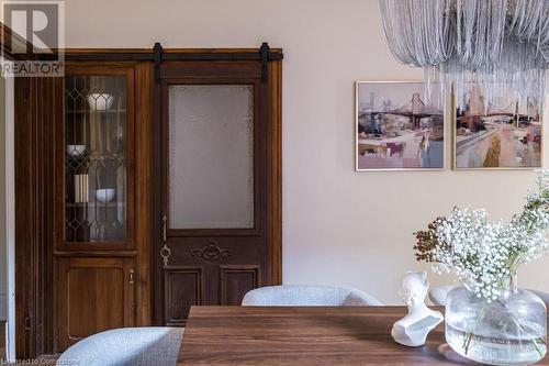 Dining space with a barn door - 109 East Avenue S, Hamilton, ON - Indoor