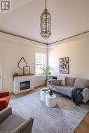 Living room featuring hardwood / wood-style floors and vaulted ceiling - 