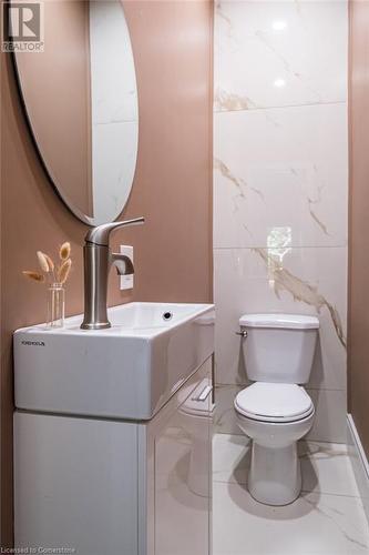 Bathroom featuring vanity and toilet - 109 East Avenue S, Hamilton, ON - Indoor Photo Showing Bathroom