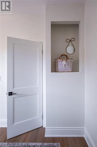 Details featuring hardwood / wood-style flooring - 109 East Avenue S, Hamilton, ON - Indoor Photo Showing Other Room