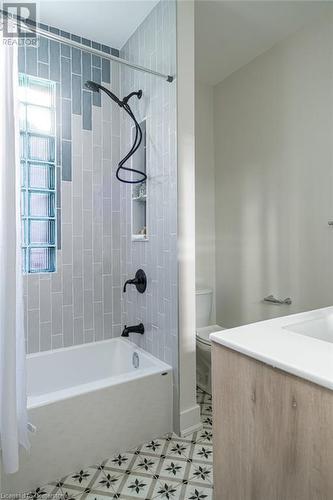 Full bathroom with vanity, shower / bath combo, and toilet - 109 East Avenue S, Hamilton, ON - Indoor Photo Showing Bathroom