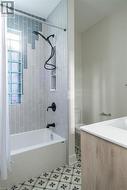 Full bathroom with vanity, shower / bath combo, and toilet - 