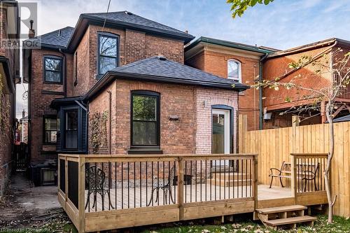 Rear view of property featuring a deck - 109 East Avenue S, Hamilton, ON - Outdoor