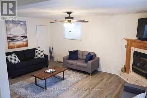 210 Desrocches Trail, Tiny, ON - Indoor Photo Showing Living Room With Fireplace