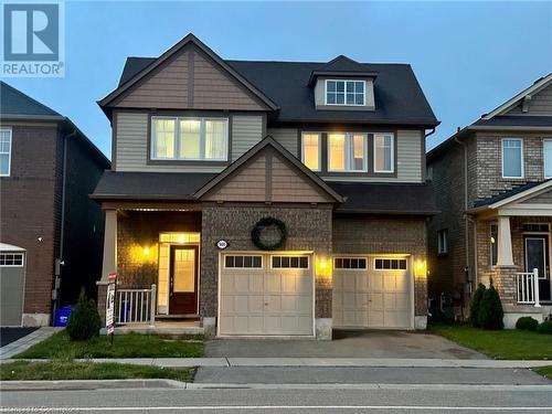 Craftsman inspired home featuring a garage - 906 Farmstead Drive, Milton, ON - Outdoor With Facade