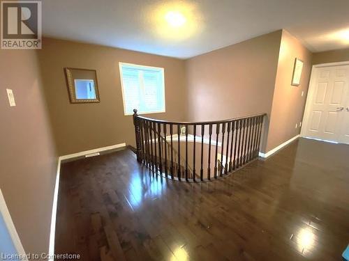 Corridor with dark wood-type flooring - 906 Farmstead Drive, Milton, ON - Indoor Photo Showing Other Room