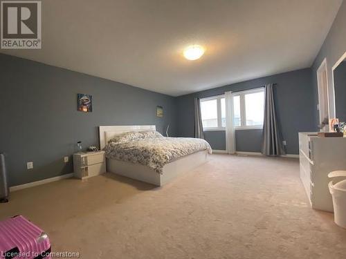 Bedroom featuring light carpet - 906 Farmstead Drive, Milton, ON - Indoor Photo Showing Bedroom