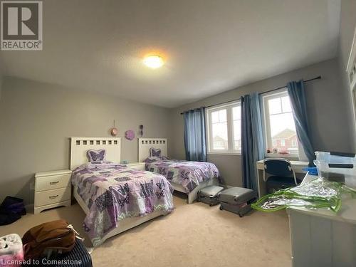 View of carpeted bedroom - 906 Farmstead Drive, Milton, ON - Indoor Photo Showing Bedroom