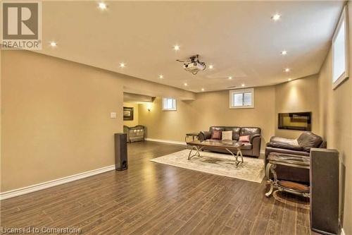 Living room featuring dark hardwood / wood-style flooring - 906 Farmstead Drive, Milton, ON - Indoor