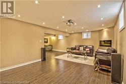 Living room featuring dark hardwood / wood-style flooring - 