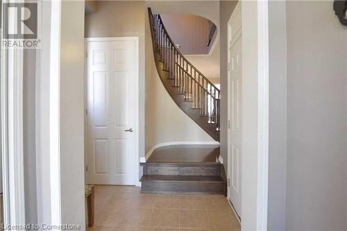 Stairs with tile patterned floors - 906 Farmstead Drive, Milton, ON - Indoor Photo Showing Other Room