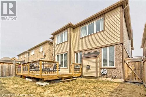 Rear view of house with a yard and a deck - 906 Farmstead Drive, Milton, ON - Outdoor With Deck Patio Veranda With Exterior