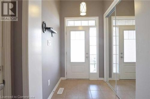 View of tiled foyer entrance - 906 Farmstead Drive, Milton, ON - Indoor Photo Showing Other Room