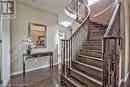 Staircase with hardwood / wood-style floors and an inviting chandelier - 906 Farmstead Drive, Milton, ON  - Indoor Photo Showing Other Room 